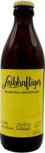 KI generiert: Das Bild zeigt eine Flasche mit dem Getränk "Laibhaftiges," einem Bier aus gerettetem Brot, mit einem gelben Etikett. Der Hauptinhalt betont Nachhaltigkeit und Vermeidung von Lebensmittelverschwendung.