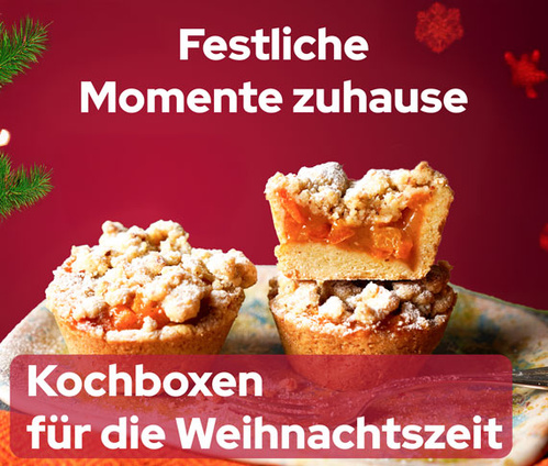KI generiert: Bild mit zwei Streuselkuchen und Text: "Festliche Momente zuhause. Kochboxen für die Weihnachtszeit".